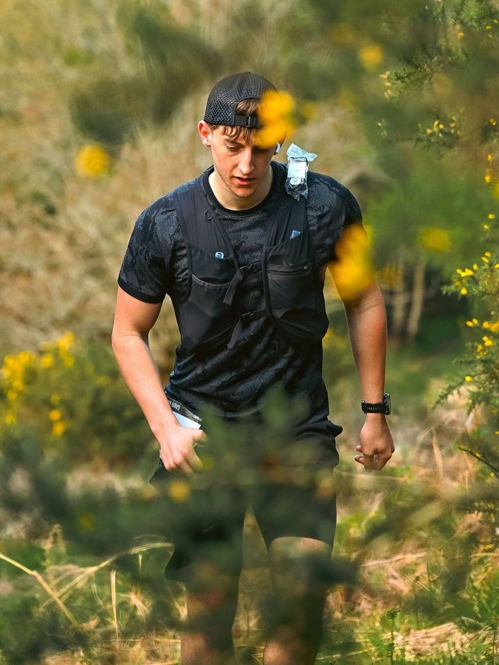 Zac running through gorse during the Ultra X Spring Trail Series